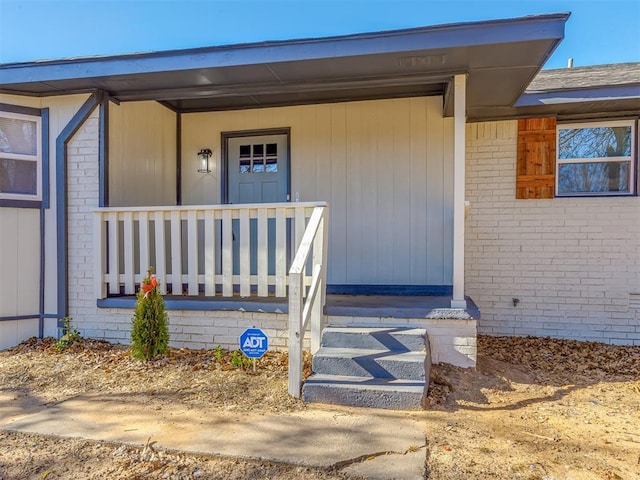 property entrance with covered porch