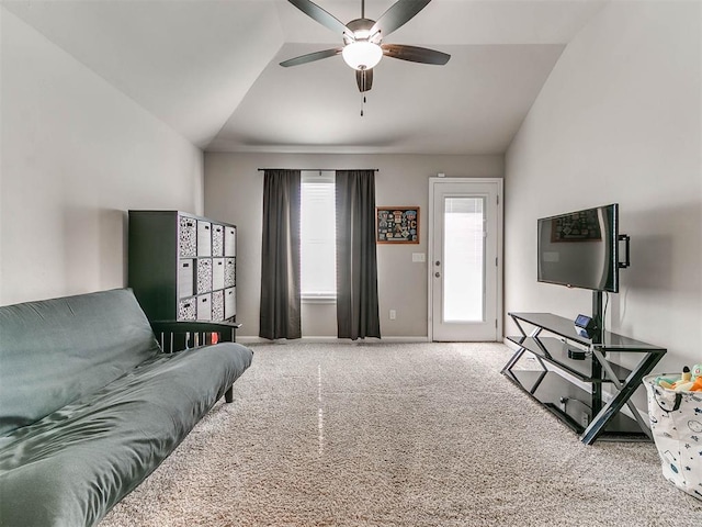 carpeted living room with ceiling fan and lofted ceiling