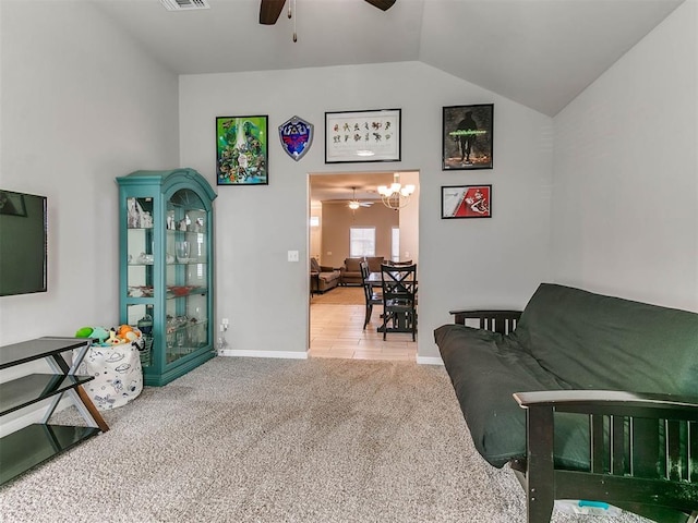 living area featuring carpet, ceiling fan, and lofted ceiling