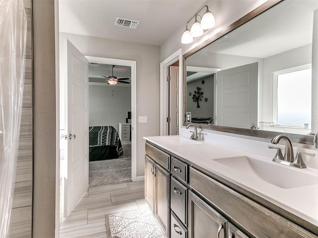 bathroom featuring vanity and ceiling fan