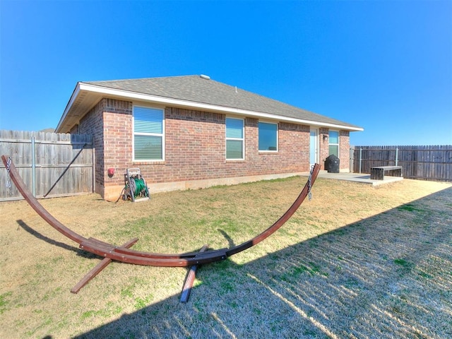 view of property exterior featuring a patio area and a yard