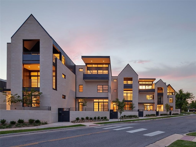 view of outdoor building at dusk