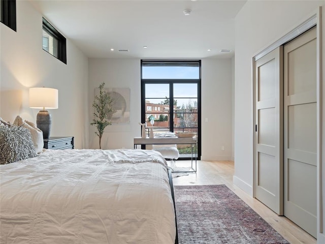 bedroom with light wood-type flooring