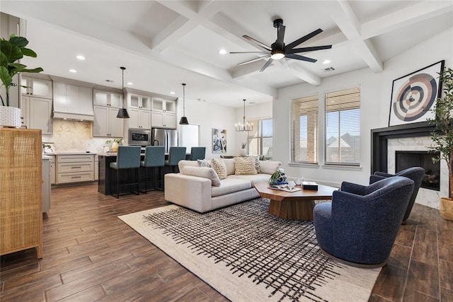 living room featuring visible vents, beam ceiling, coffered ceiling, dark wood-style floors, and a fireplace