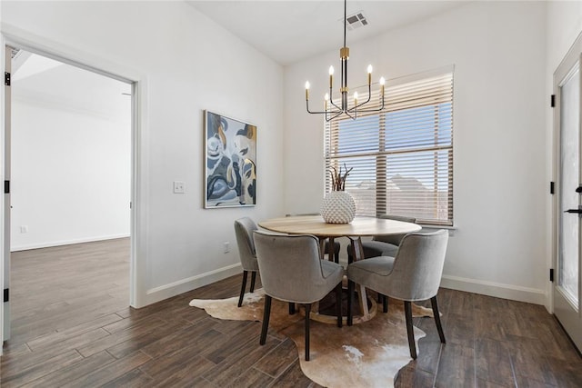 dining area with an inviting chandelier, dark wood-style floors, visible vents, and baseboards