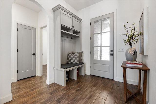 14704 Ashore Dr, Oklahoma City, OK 73142 - mudroom featuring arched walkways, baseboards, and dark wood finished floors