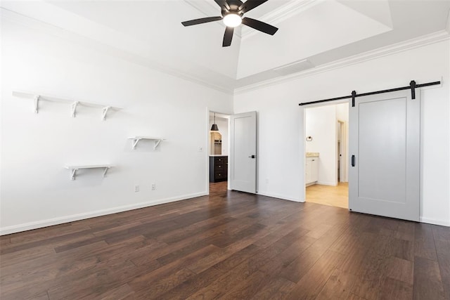 14704 Ashore Dr, Oklahoma City, OK 73142 - unfurnished bedroom with a raised ceiling, a barn door, wood finished floors, baseboards, and ornamental molding