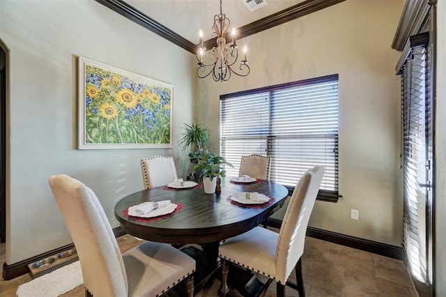 dining area with a notable chandelier and ornamental molding