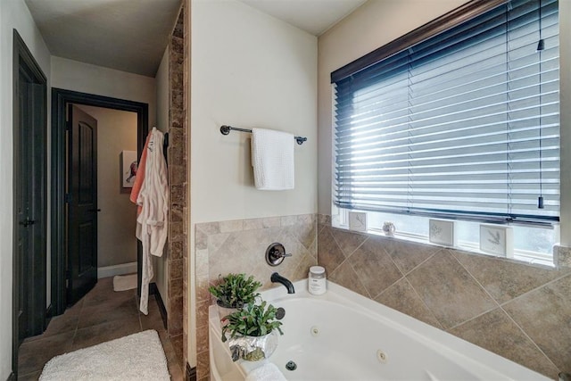 bathroom featuring a bathing tub and tile patterned flooring