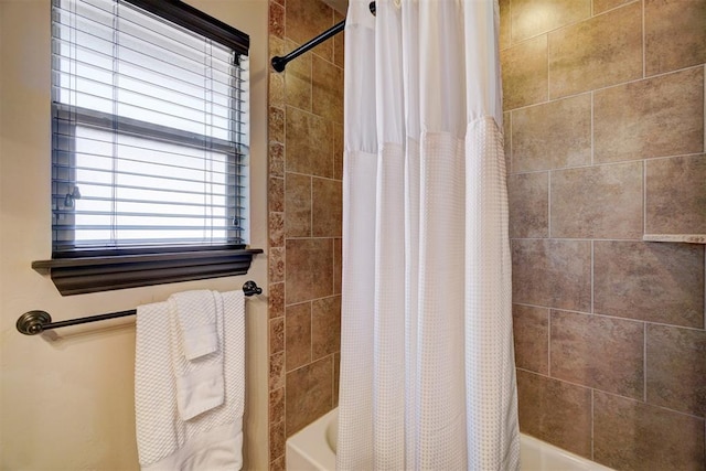 bathroom featuring shower / tub combo