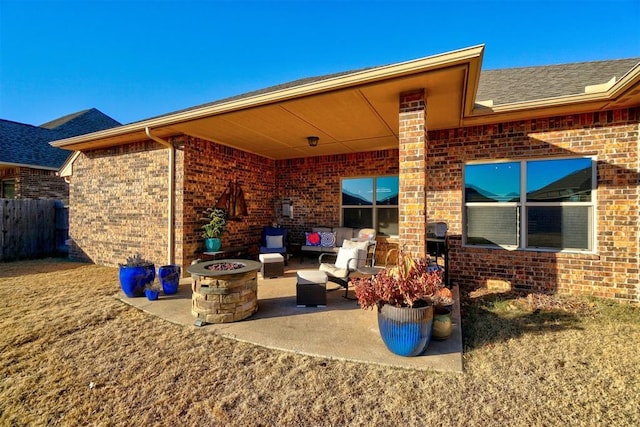 view of patio featuring an outdoor living space with a fire pit