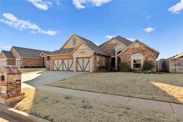 view of front of house featuring a garage and a front lawn