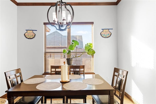 dining room featuring ornamental molding and a chandelier