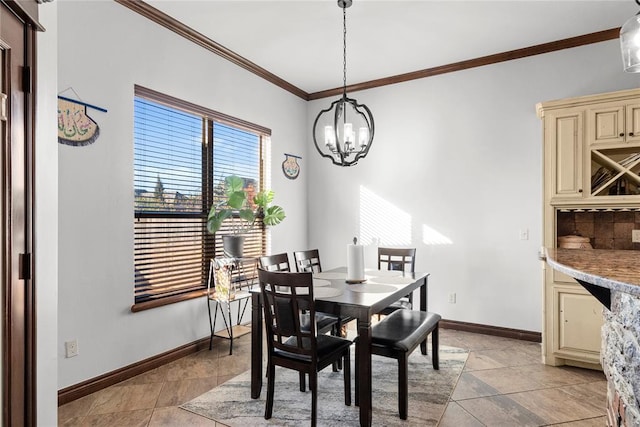 dining room featuring ornamental molding and a notable chandelier