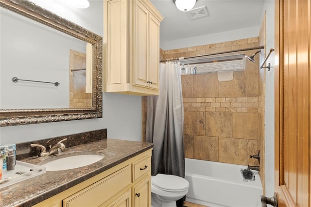 full bathroom featuring vanity, toilet, and shower / tub combo