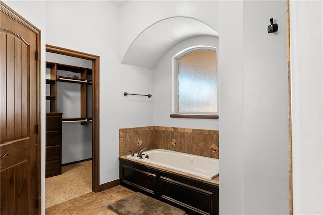 bathroom featuring a tub to relax in