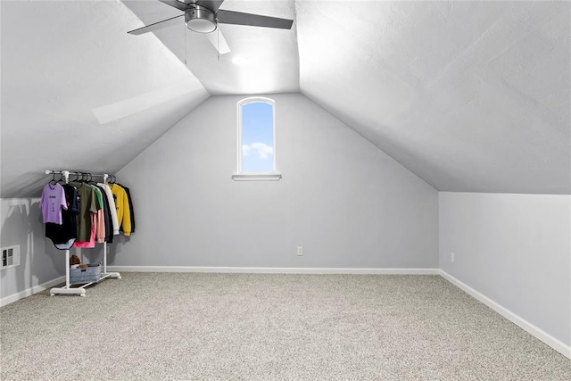 additional living space featuring vaulted ceiling, ceiling fan, and carpet floors