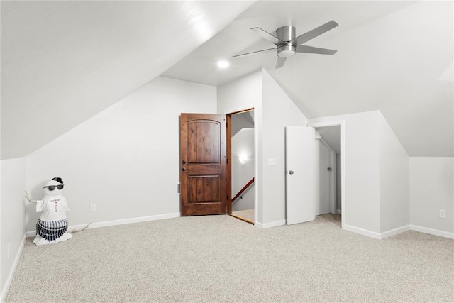 bonus room featuring ceiling fan, light colored carpet, and vaulted ceiling