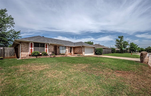 ranch-style home featuring a garage and a front lawn