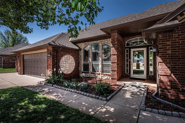 doorway to property featuring a garage