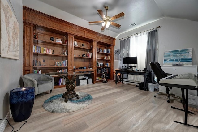 home office with light wood-type flooring, ceiling fan, and lofted ceiling