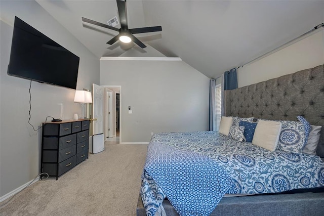 carpeted bedroom with ceiling fan and vaulted ceiling