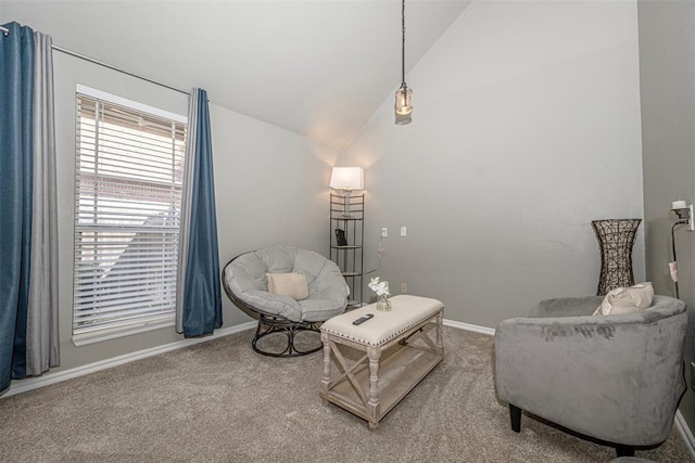 sitting room with carpet and lofted ceiling