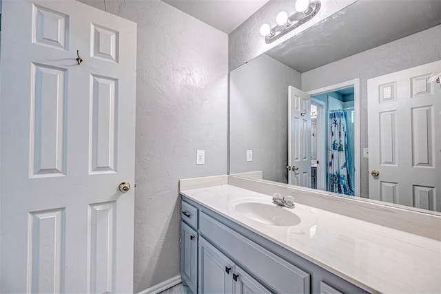 bathroom with vanity and walk in shower