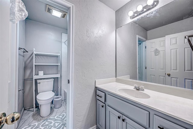 bathroom with vanity and toilet