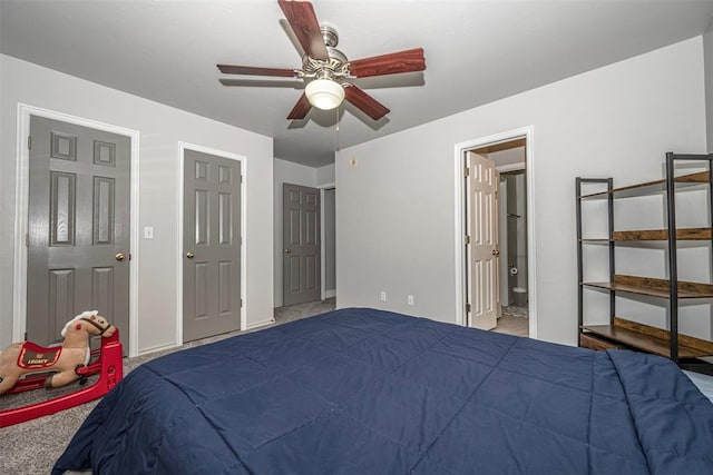 carpeted bedroom featuring ceiling fan and ensuite bath