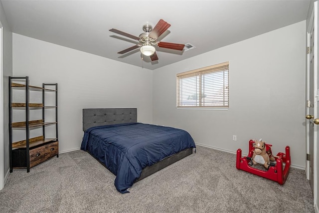 bedroom with ceiling fan and light carpet