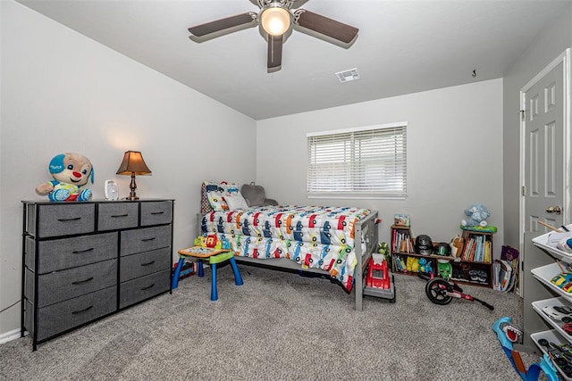 bedroom with ceiling fan and carpet floors