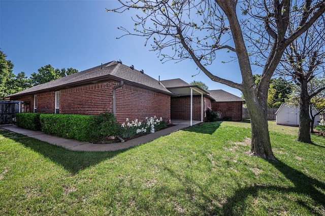 view of home's exterior with a shed and a yard