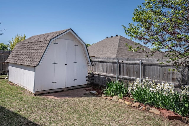 view of outdoor structure featuring a lawn