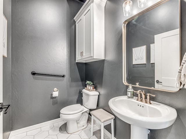 bathroom with sink and toilet