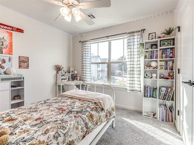 carpeted bedroom featuring ceiling fan