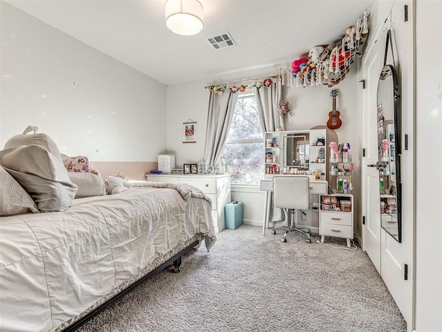 bedroom featuring light carpet