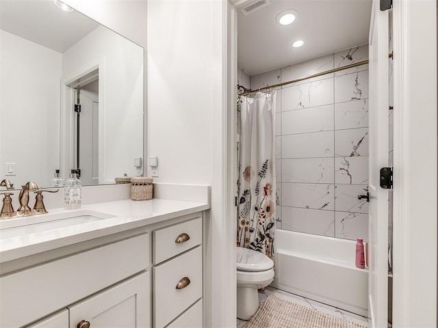 full bathroom featuring vanity, tile patterned flooring, toilet, and shower / bath combo with shower curtain