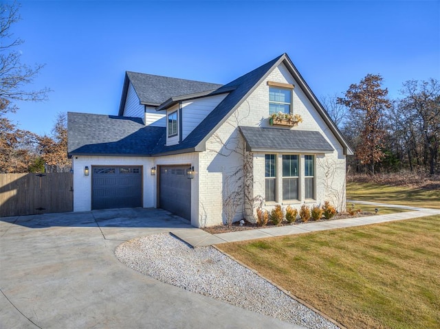 view of front facade featuring a garage and a front yard