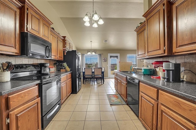 kitchen with backsplash, black appliances, light tile patterned floors, a notable chandelier, and hanging light fixtures