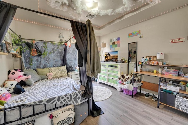 bedroom with light wood-type flooring