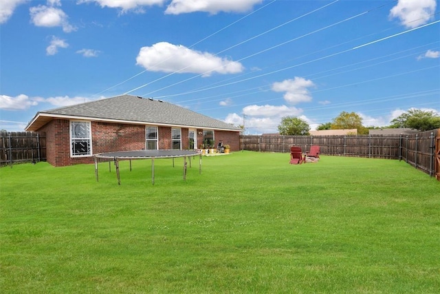 view of yard featuring a trampoline