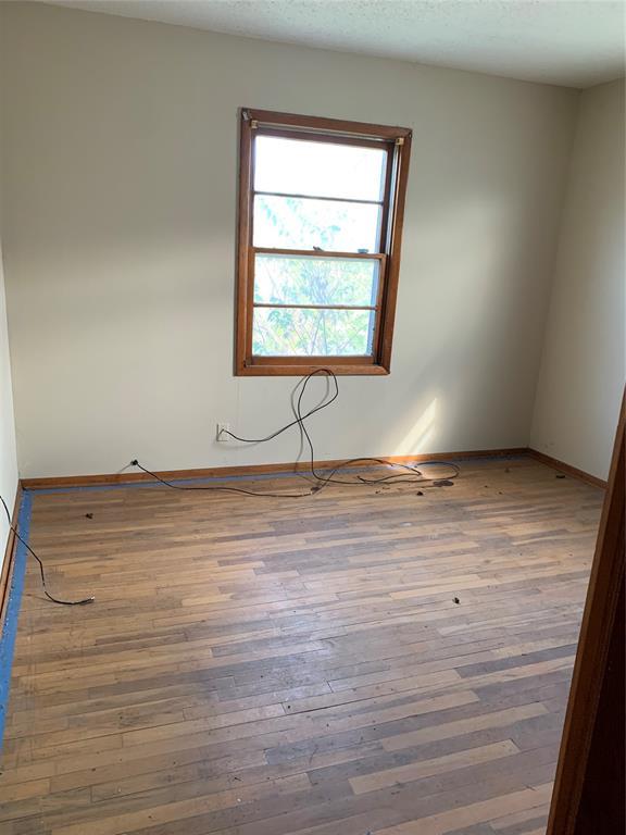 unfurnished room featuring hardwood / wood-style floors