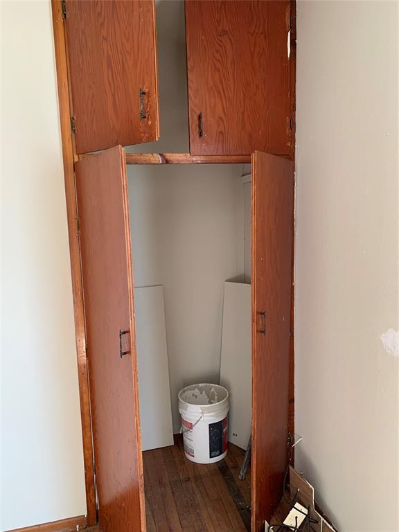 bathroom with hardwood / wood-style flooring