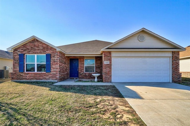 ranch-style home with central AC unit, a garage, and a front yard