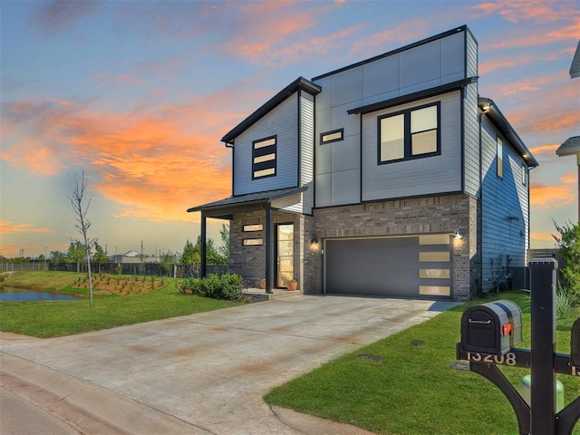 contemporary home with a lawn and a garage