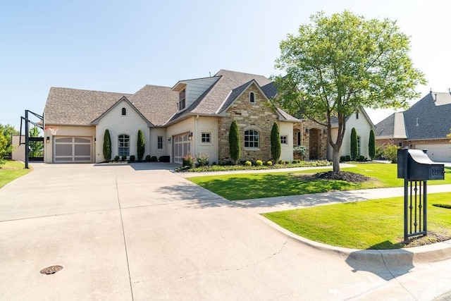 french country home featuring a front yard