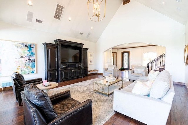 living room with dark hardwood / wood-style flooring, high vaulted ceiling, a chandelier, and beamed ceiling