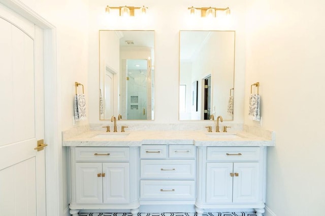 bathroom featuring vanity, an enclosed shower, and ornamental molding