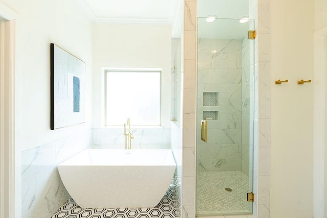 bathroom with separate shower and tub and ornamental molding